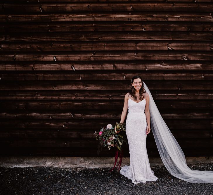 Bride With Long Veil and Pink Bouquet