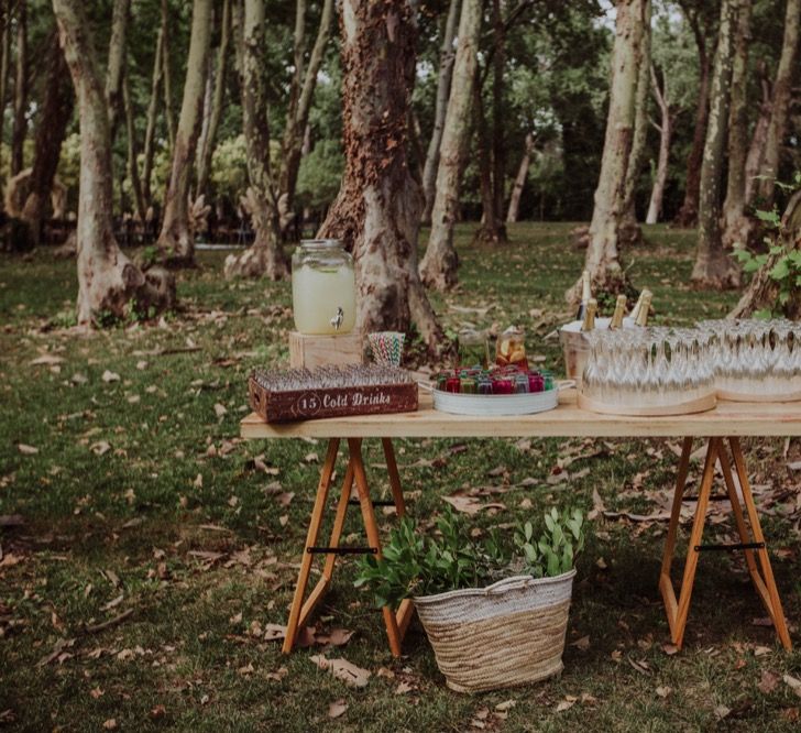 Drinks Station with Drinks Dispenser | Woodland Wedding at Sa Farinera de Sant LLuis Wedding Venue, Catalan Empordà, Spain | Planned &amp; Styled by Mille Papillons | HUMà06 Photography | HUMà06 Photography