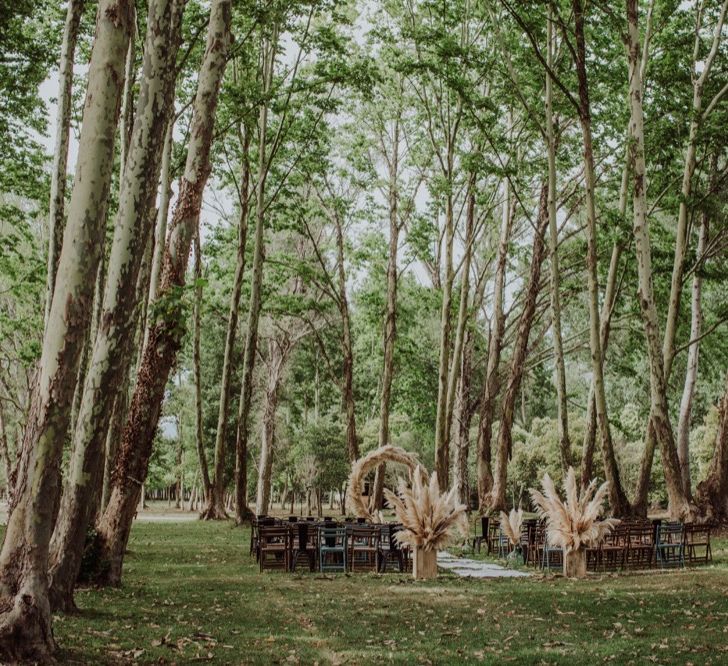 Pampas Grass Moongate &amp; Aisle Floral Arrangements | Outdoor Woodland Wedding at Sa Farinera de Sant LLuis Wedding Venue, Catalan Empordà, Spain | Planned &amp; Styled by Mille Papillons | HUMà06 Photography | HUMà06 Photography