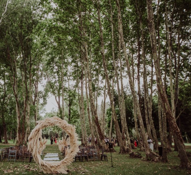 Pampas Grass Moongate &amp; Aisle Floral Arrangements | Outdoor Woodland Wedding at Sa Farinera de Sant LLuis Wedding Venue, Catalan Empordà, Spain | Planned &amp; Styled by Mille Papillons | HUMà06 Photography | HUMà06 Photography