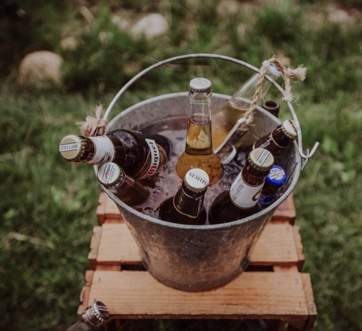 Bottles of Beer in a Bucket | Outdoor Woodland Wedding at Sa Farinera de Sant LLuis Wedding Venue, Catalan Empordà, Spain | Planned &amp; Styled by Mille Papillons | HUMà06 Photography | HUMà06 Photography