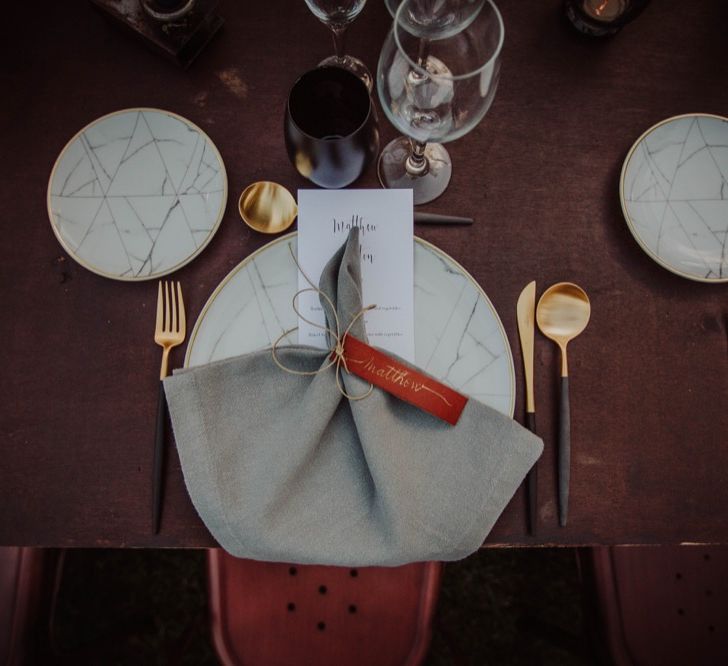 Elegant Place Setting with Leather Name Place Card, Gold Cutlery &amp; Marble Tableware | Outdoor Woodland Wedding at Sa Farinera de Sant LLuis Wedding Venue, Catalan Empordà, Spain | Planned &amp; Styled by Mille Papillons | HUMà06 Photography | HUMà06 Photography