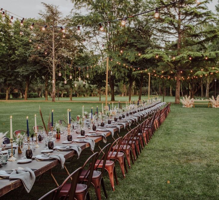 Al Fresco Long Trestle Tablescape with Festoon Lights | Outdoor Woodland Wedding at Sa Farinera de Sant LLuis Wedding Venue, Catalan Empordà, Spain | Planned &amp; Styled by Mille Papillons | HUMà06 Photography | HUMà06 Photography