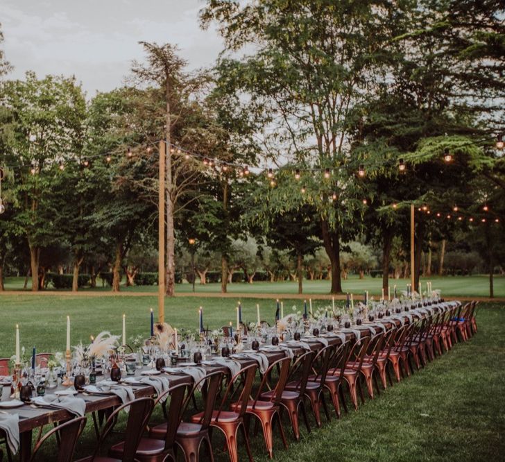 Al Fresco Long Trestle Tablescape with Festoon Lights | Outdoor Woodland Wedding at Sa Farinera de Sant LLuis Wedding Venue, Catalan Empordà, Spain | Planned &amp; Styled by Mille Papillons | HUMà06 Photography | HUMà06 Photography