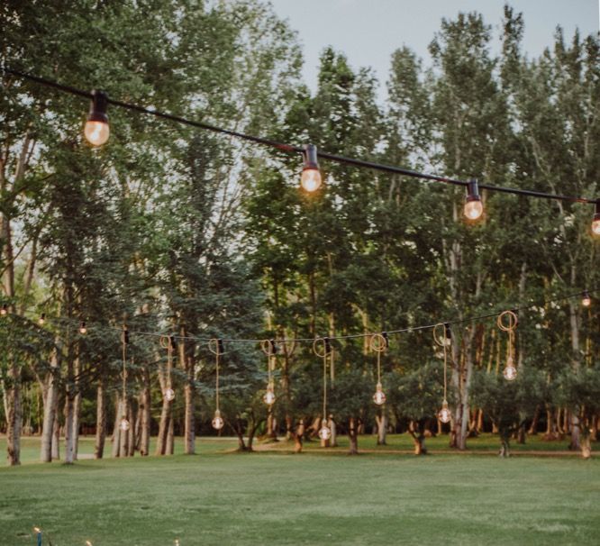 Al Fresco Long Trestle Tablescape with Festoon Lights | Outdoor Woodland Wedding at Sa Farinera de Sant LLuis Wedding Venue, Catalan Empordà, Spain | Planned &amp; Styled by Mille Papillons | HUMà06 Photography | HUMà06 Photography