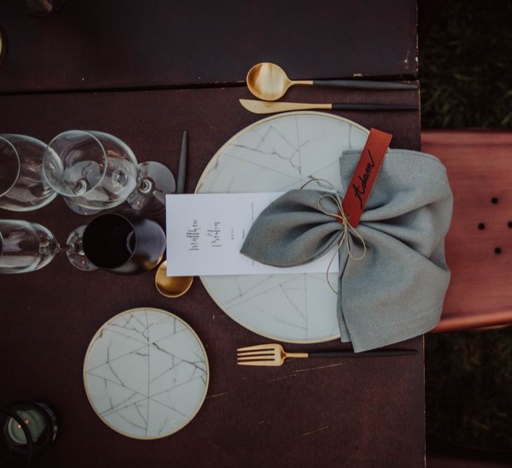 Elegant Place Setting with Leather Name Place Card, Gold Cutlery &amp; Marble Tableware | Outdoor Woodland Wedding at Sa Farinera de Sant LLuis Wedding Venue, Catalan Empordà, Spain | Planned &amp; Styled by Mille Papillons | HUMà06 Photography | HUMà06 Photography