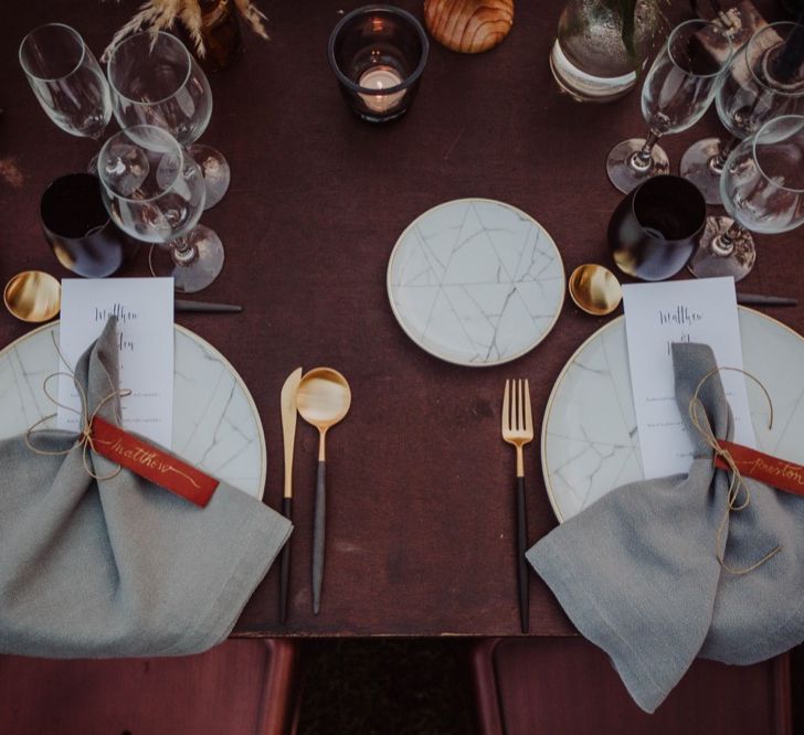 Elegant Place Setting with Leather Name Place Card, Gold Cutlery &amp; Marble Tableware | Outdoor Woodland Wedding at Sa Farinera de Sant LLuis Wedding Venue, Catalan Empordà, Spain | Planned &amp; Styled by Mille Papillons | HUMà06 Photography | HUMà06 Photography