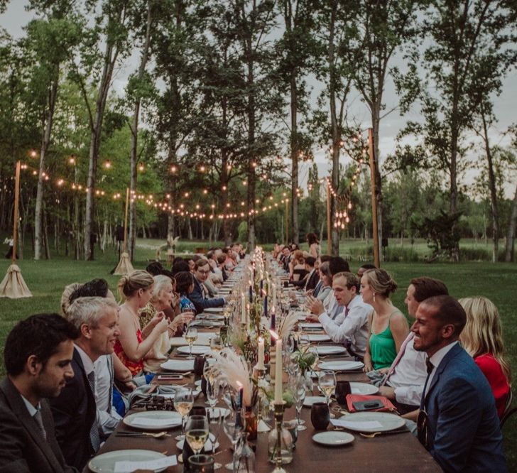 Outdoor Wedding Reception with Festoon Lights | Woodland Wedding Ceremony at Sa Farinera de Sant LLuis Wedding Venue, Catalan Empordà, Spain | Planned &amp; Styled by Mille Papillons | HUMà06 Photography | HUMà06 Photography