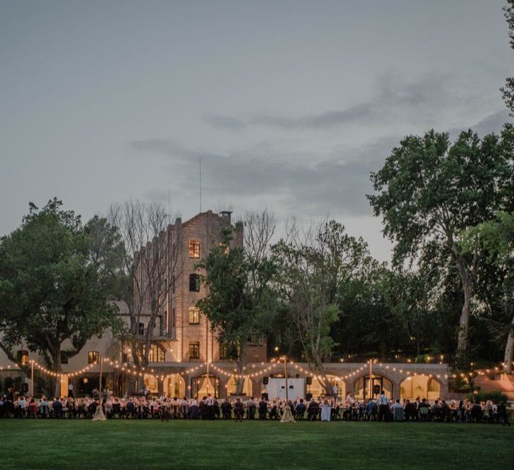 Outdoor Wedding Reception with Festoon Lights | Woodland Wedding Ceremony at Sa Farinera de Sant LLuis Wedding Venue, Catalan Empordà, Spain | Planned &amp; Styled by Mille Papillons | HUMà06 Photography | HUMà06 Photography