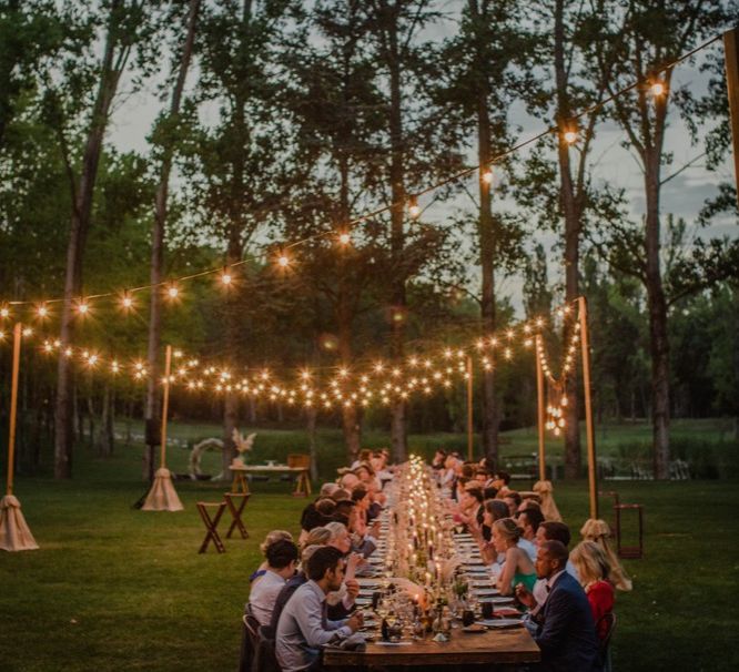 Outdoor Wedding Reception with Festoon Lights | Woodland Wedding Ceremony at Sa Farinera de Sant LLuis Wedding Venue, Catalan Empordà, Spain | Planned &amp; Styled by Mille Papillons | HUMà06 Photography | HUMà06 Photography