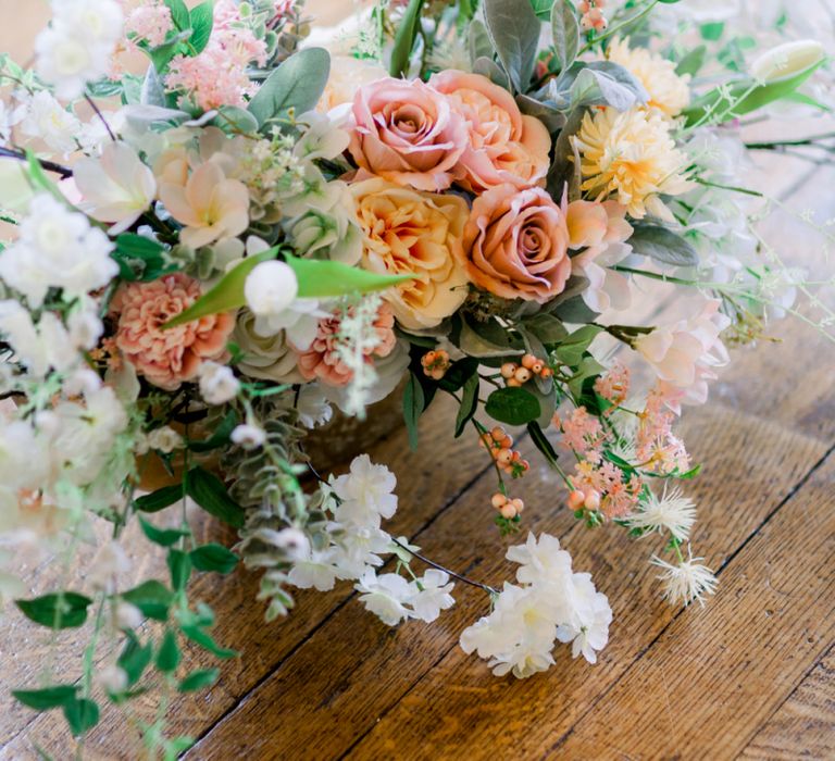 Pastel peach and white flowers at Prestwold Hall wedding