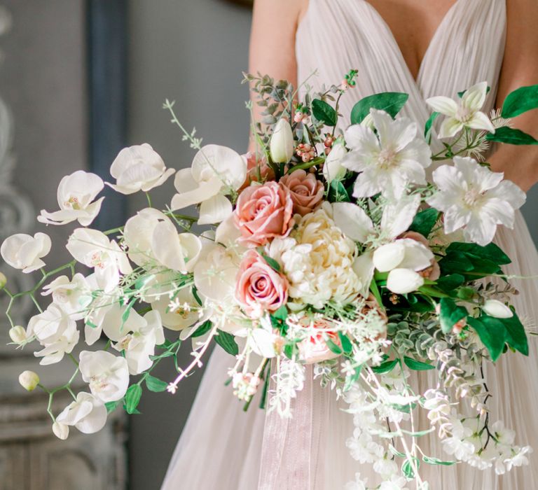 Romantic peach and white wedding bouquet with orchids for Prestwold Hall wedding