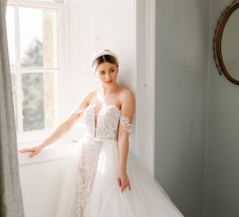 Bride in off the shoulder lace dress with detachable tulle overskirt