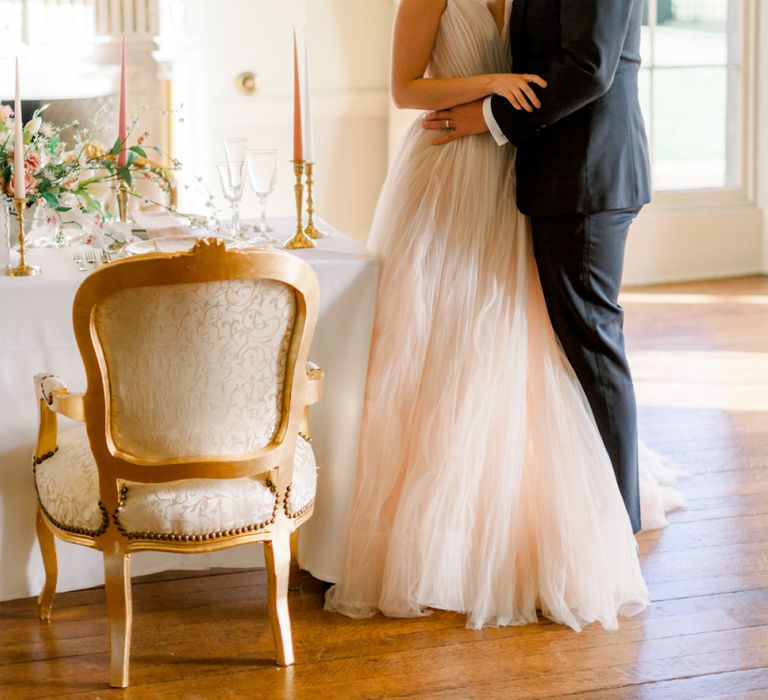 Bride and groom kissing at Pretwold Hall wedding reception