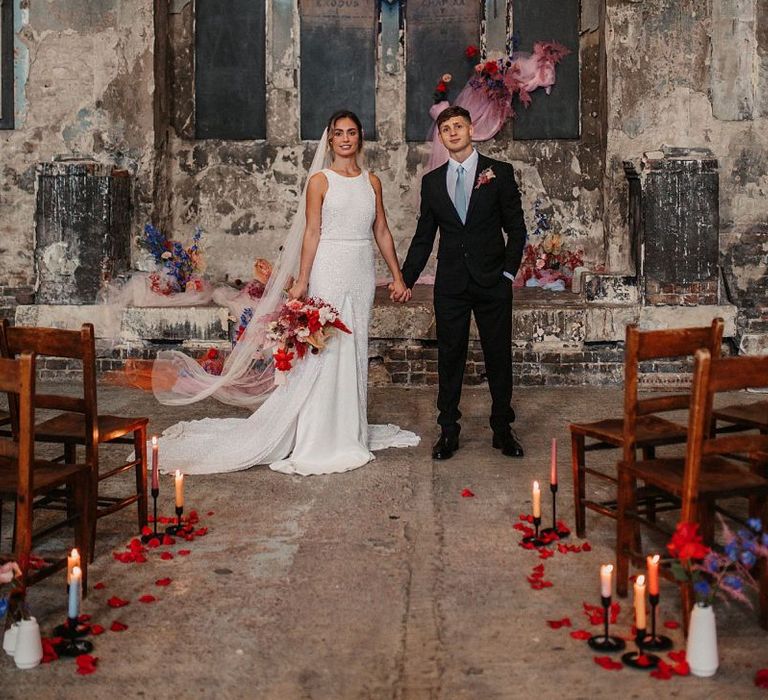 Bride and Groom Portrait at the Asylum Chapel with Pink Wedding Decor