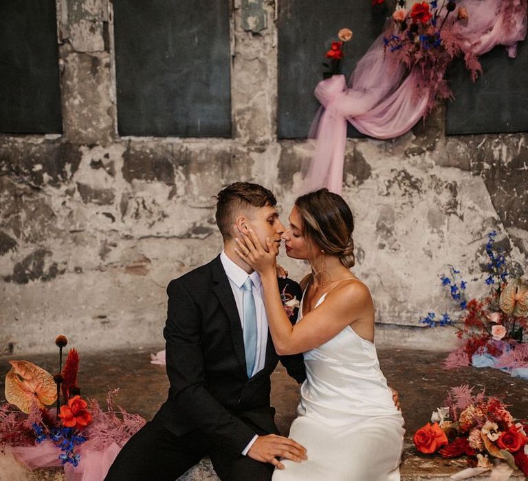 Bride in Satin Minimalist Wedding Dress and pink wedding jacket