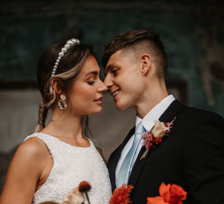 Stylish Bride in Sequin Dress, Pearl Headband and pink wedding jacket