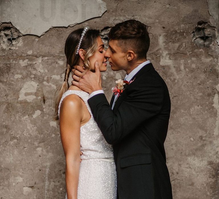 Groom Kissing His Bride in a Sequin Wedding Dress