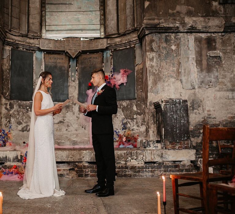 Bride and Groom Standing at the Altar of the Asylum Chapel