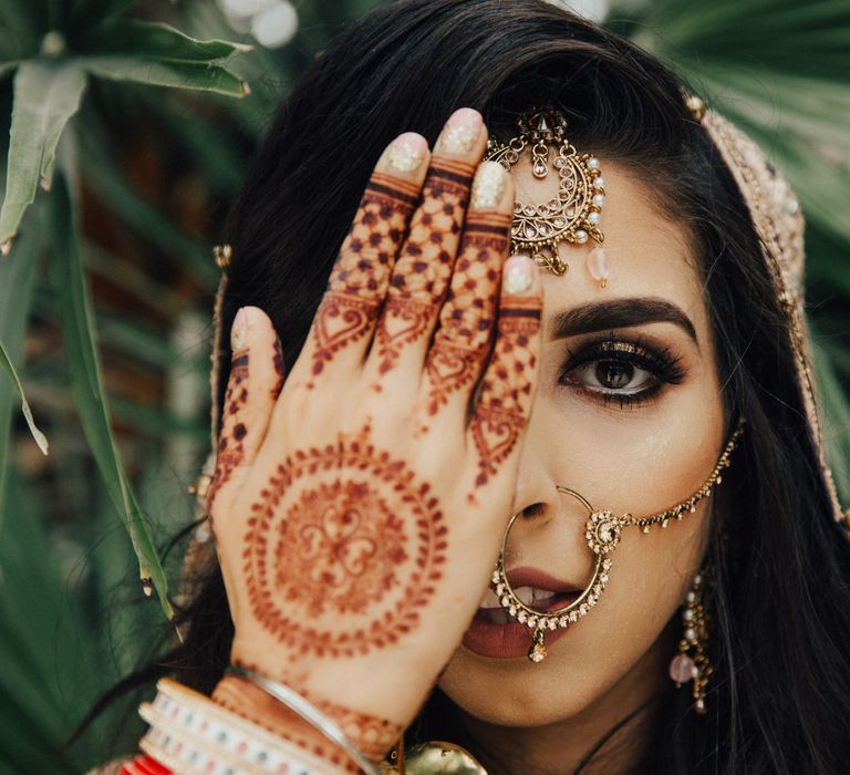 Indian Bride with Henna Hand Art and Bridal makeup