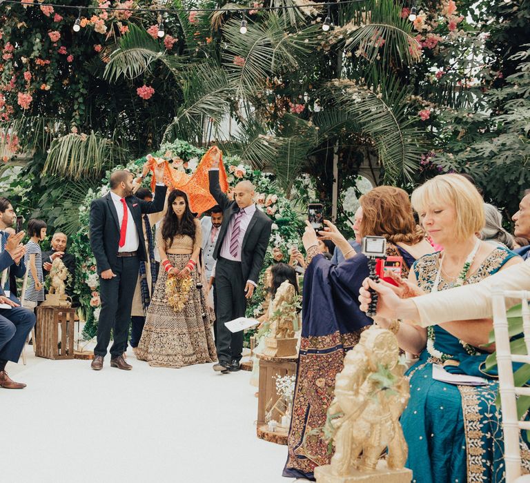 Indian Wedding Ceremony Bride Entrance Under a Canopy Held by Her Brothers