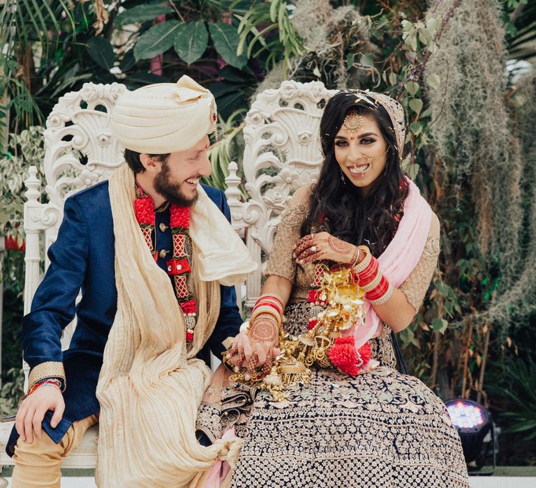 Bride in Navy and Gold Saree and Groom in Navy and Gold Suit with Turban