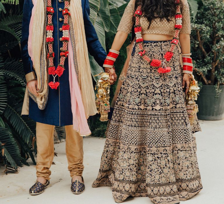 Bride and Groom in Gold and Navy Hindu Wedding Dress and Suit