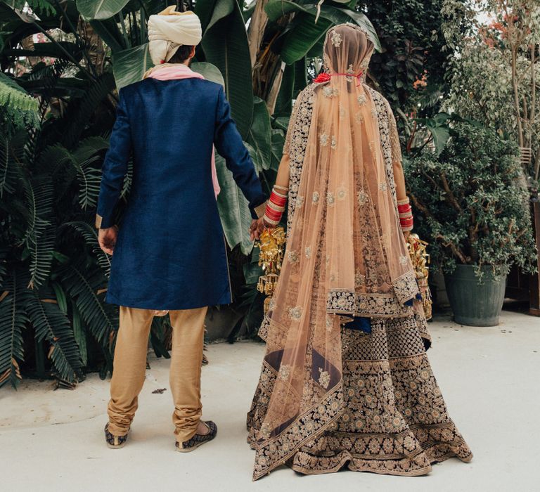 Bride and Groom in Navy and Gold Hindu Wedding Attire