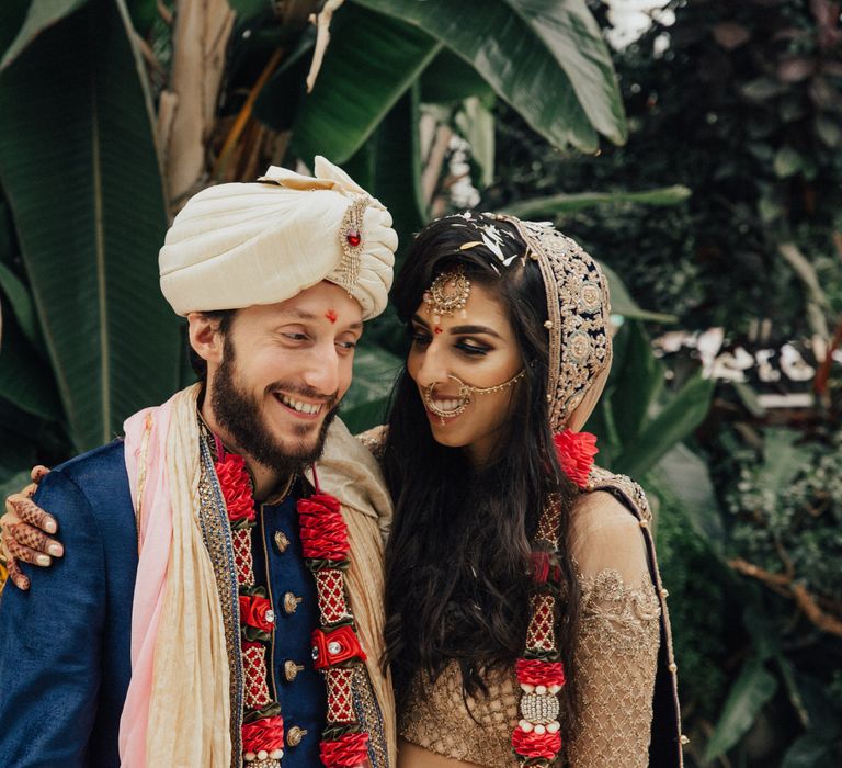 Bride and Groom in Navy and Gold Wedding Dress