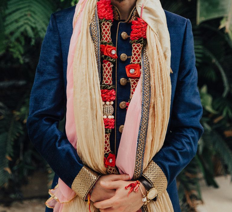 Groom in Traditional Navy and Gold Suit and Turban