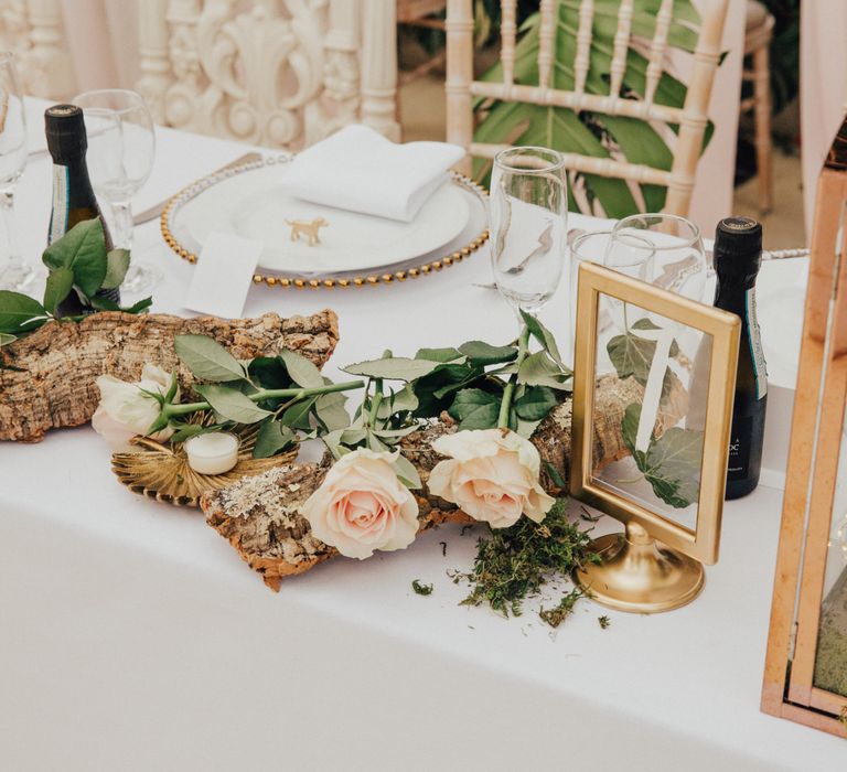 Top Table Wedding Decor with Tree Branch and Roses