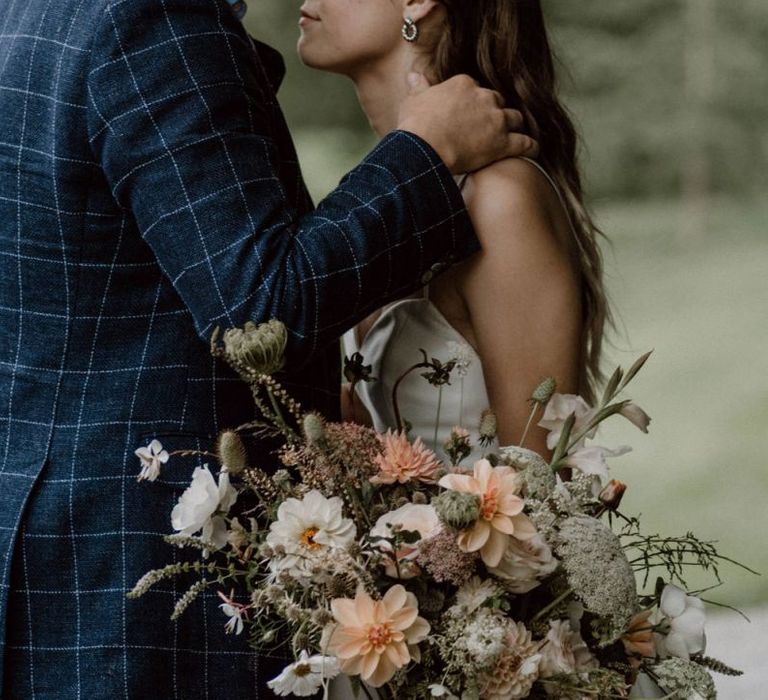 Groom in Blue Check Blazer Kissing HIs Brides Forehead