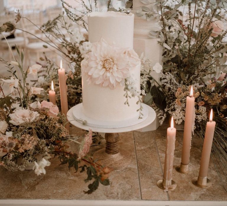 Two Tier Wedding Cake with Giant Dahlia Decor, Candles and Floral Arrangements