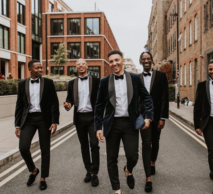 Stylish groomsmen in navy dinner jackets