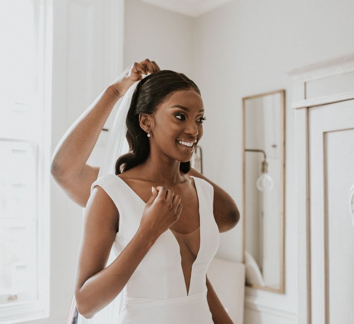 Black bride in deep V front Made With Love Bridal gown