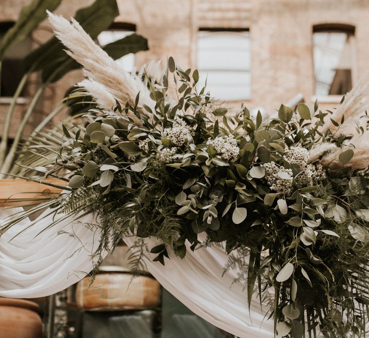 Green foliage and pampas grass wedding flowers