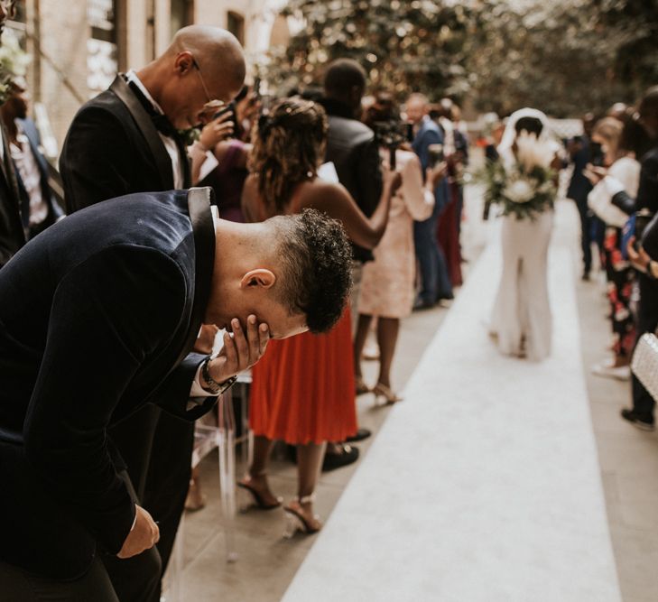 Emotional groom as his bride walks down the altar