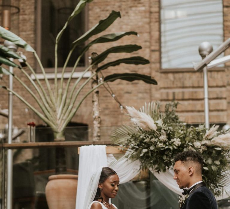 Emotional bride reading her vows at Devonshire Terrace wedding ceremony