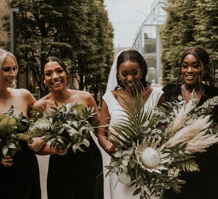 Happy bridal party portrait with King Protea, Pampas Grass and foliage wedding bouquets