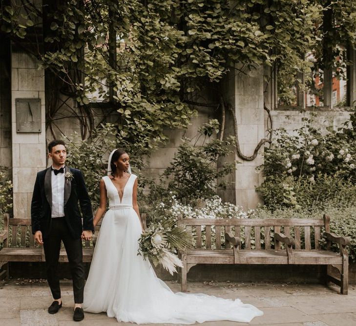 Stylish bride and groom in black-tie attire