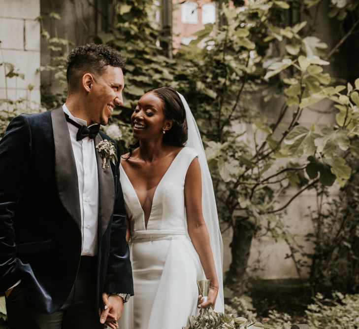 Elegant deep V front wedding dress and navy tuxedo jacket