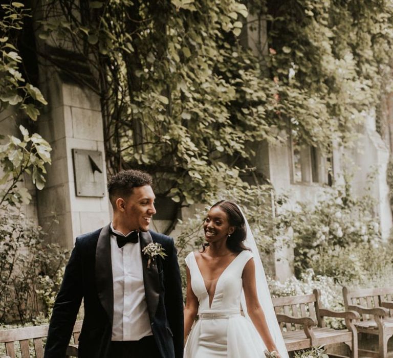 Black bride in front split wedding dress and lace up bridal shoes