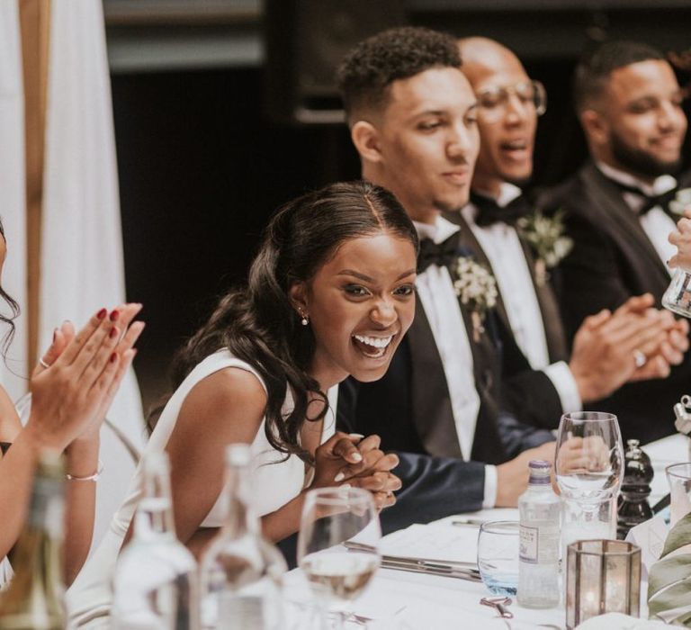 Bride laughing during the Devonshire Terrace wedding reception speeches