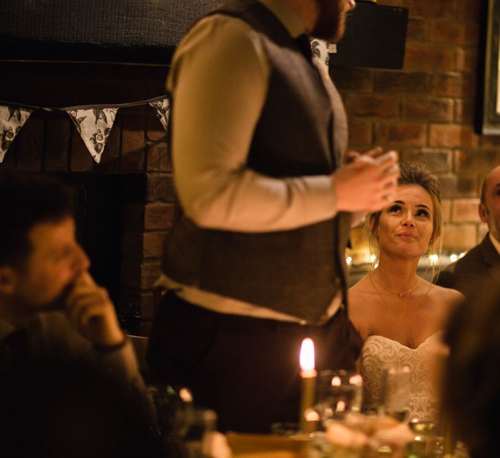 Christmas Pub Wedding At The Falcon Rotherwick With Bride In Alice By Watters And Candle Lit Wedding Ceremony Images By Rebecca Searle Photography