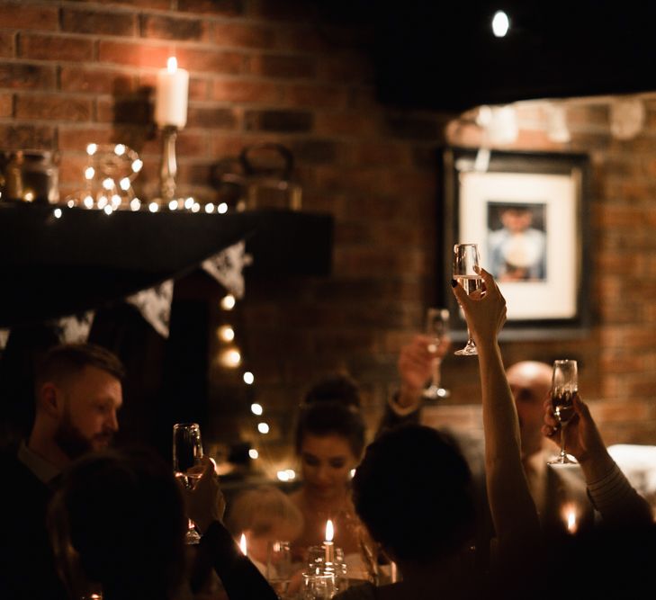 Christmas Pub Wedding At The Falcon Rotherwick With Bride In Alice By Watters And Candle Lit Wedding Ceremony Images By Rebecca Searle Photography