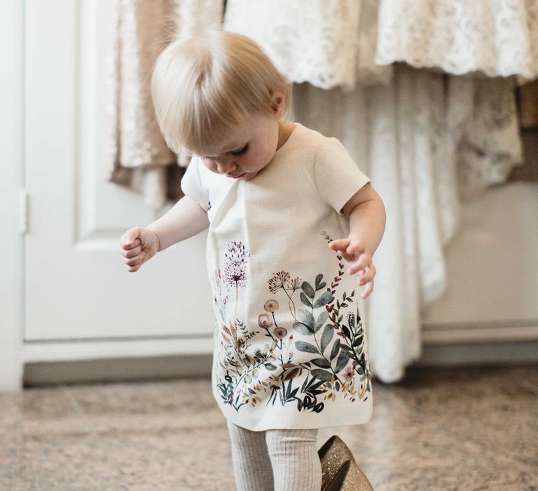 Flower Girl In Zara Baby Dress // Christmas Pub Wedding At The Falcon Rotherwick With Bride In Alice By Watters And Candle Lit Wedding Ceremony Images By Rebecca Searle Photography