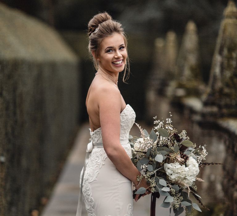 Bride &amp; Bridesmaids In Winter Wedding Attire // Bride In Alice Dress By Watters // Christmas Pub Wedding At The Falcon Rotherwick With Bride In Alice By Watters And Candle Lit Wedding Ceremony Images By Rebecca Searle Photography