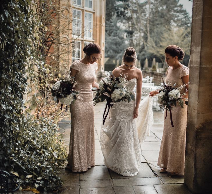 Bride &amp; Bridesmaids In Winter Wedding Attire // Bride In Alice Dress By Watters // Christmas Pub Wedding At The Falcon Rotherwick With Bride In Alice By Watters And Candle Lit Wedding Ceremony Images By Rebecca Searle Photography