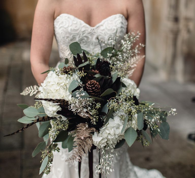 Winter Wedding Bouquet // Bride In Alice Dress By Watters // Christmas Pub Wedding At The Falcon Rotherwick With Bride In Alice By Watters And Candle Lit Wedding Ceremony Images By Rebecca Searle Photography