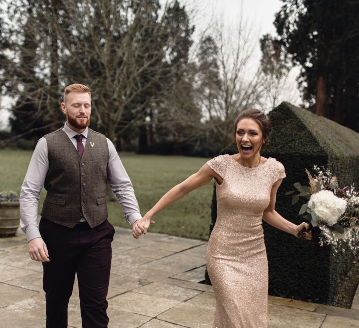 Bridesmaids Walking With Groom For 'First Look' At The Bride // Bride In Alice Dress By Watters // Christmas Pub Wedding At The Falcon Rotherwick With Bride In Alice By Watters And Candle Lit Wedding Ceremony Images By Rebecca Searle Photography